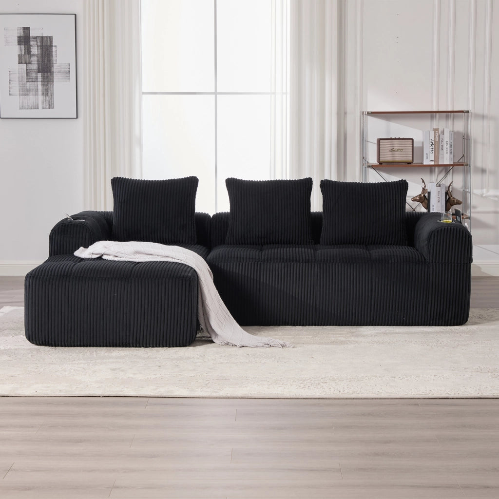Divano modulare compatto 253x158x61 cm con tasche laterali e portabicchieri; velluto a coste nero; 3 cuscini