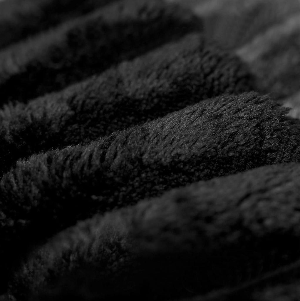 Pouf in tessuto nero senza montaggio