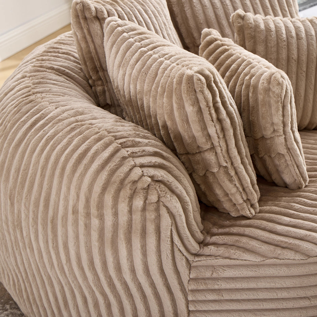 Poltrona pouf rotonda con poggiapiedi e cinque cuscini, schienale e braccioli in cheniglia cammello e marrone