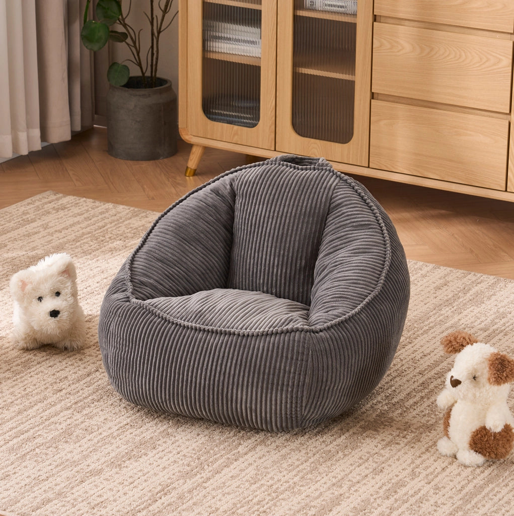 Pouf a sacco ULEVR per bambini in velluto a coste grigio, con forma curva di supporto
