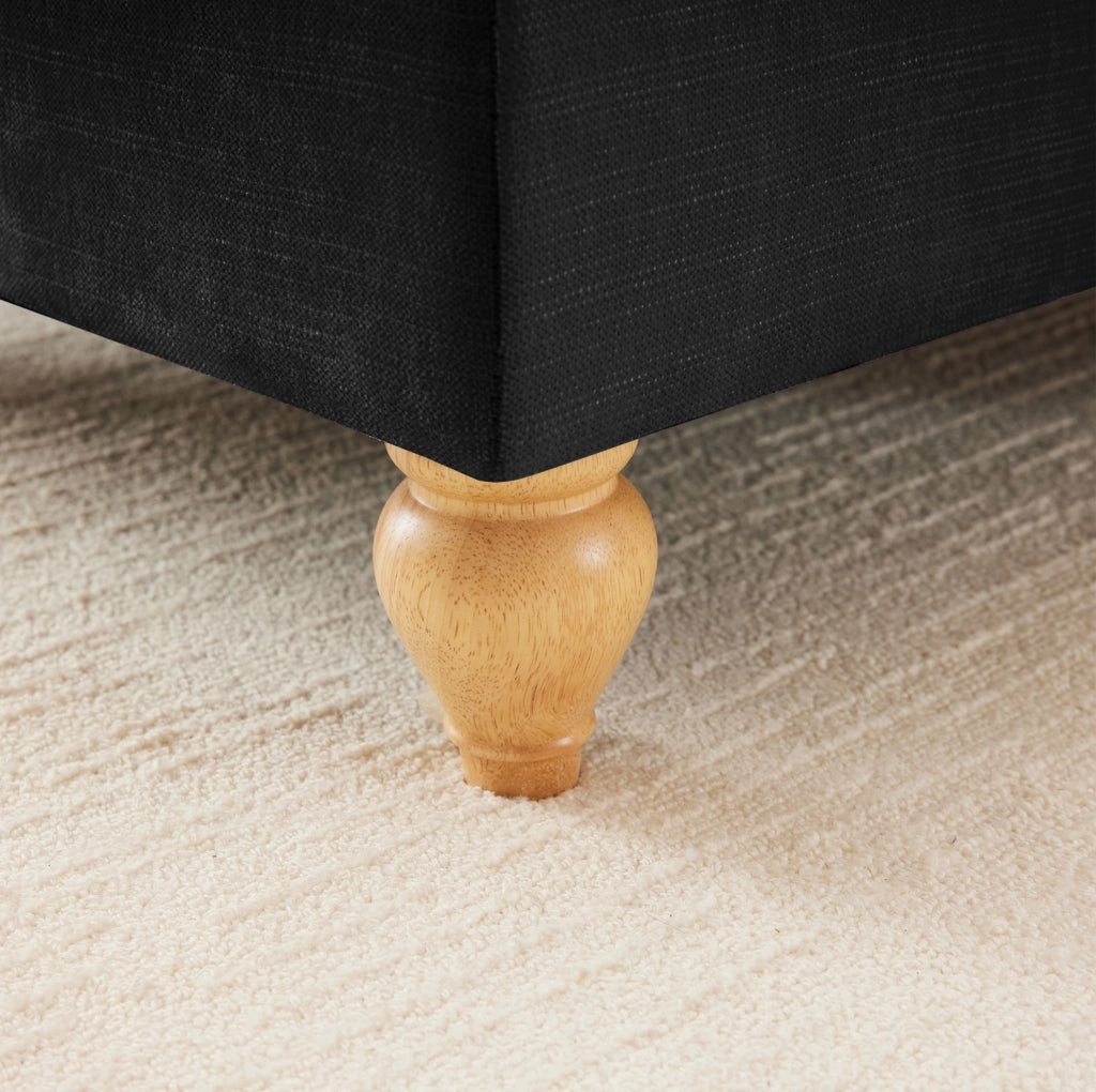 Pouf Windsor in tessuto chenille nero con design versatile