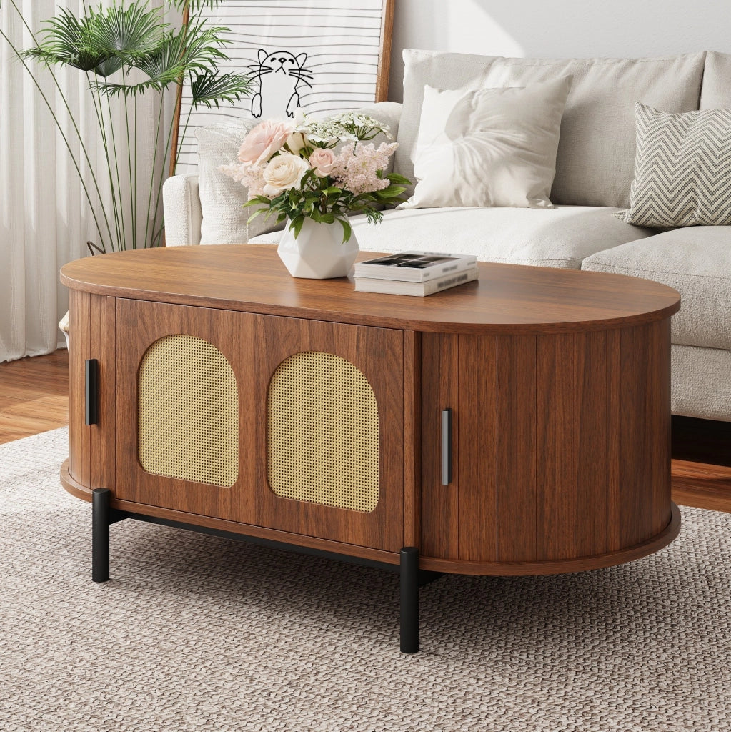 Tavolino da caffè ovale in MDF color noce con ante in rattan e piedi in metallo
