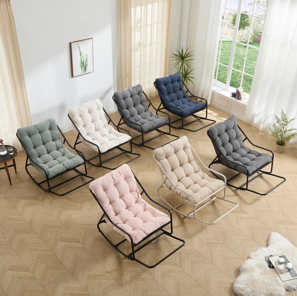 Poltrona a dondolo con pouf, struttura nera e cuscino verde chiaro