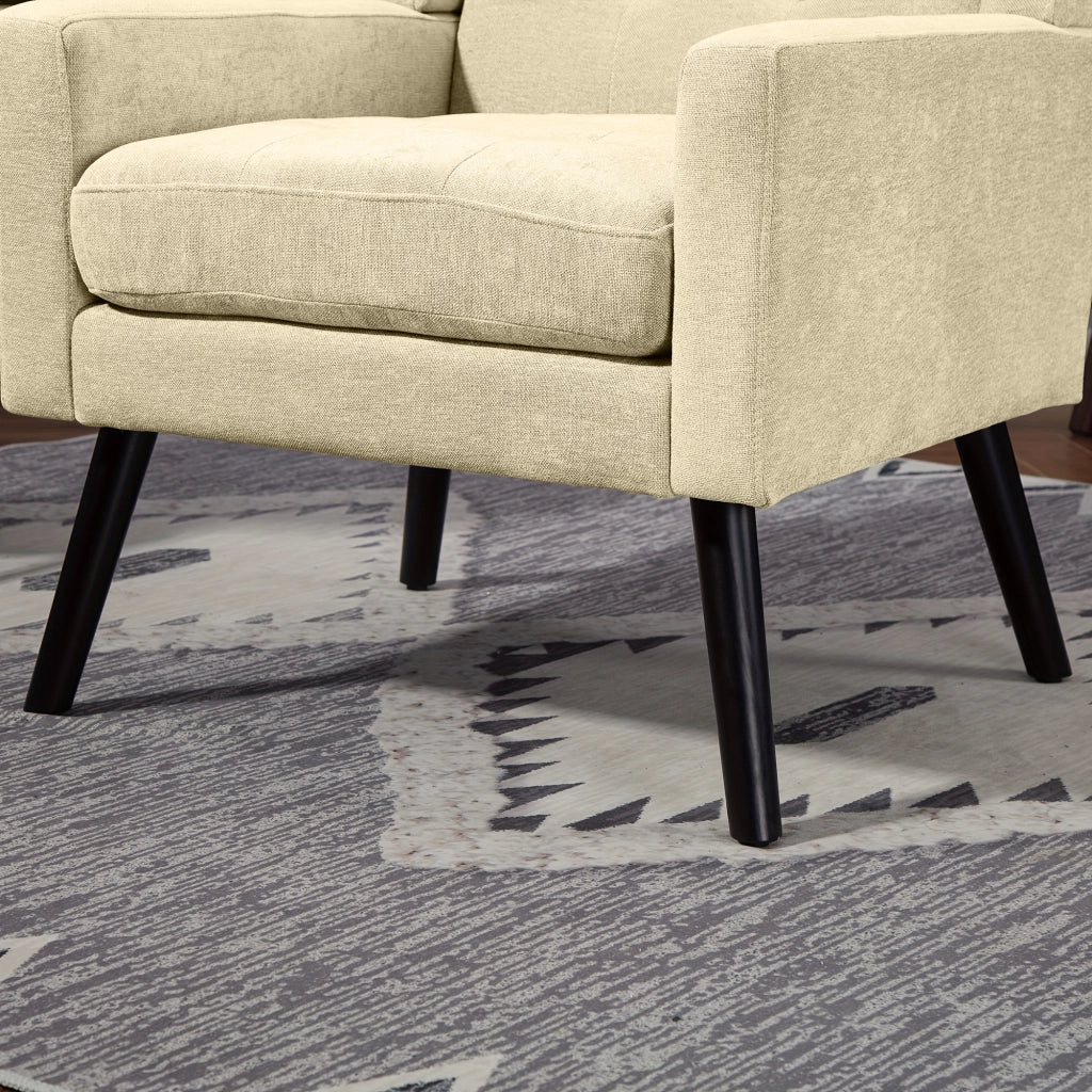 Sedia imbottita con trapuntatura e gambe in legno